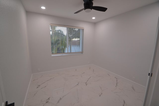 spare room featuring recessed lighting, marble finish floor, baseboards, and ceiling fan