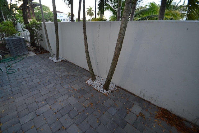 view of patio / terrace featuring fence and central AC