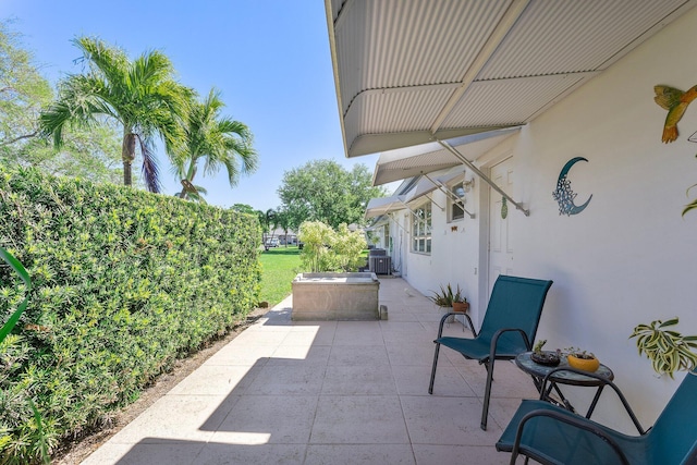 view of patio / terrace with central AC unit