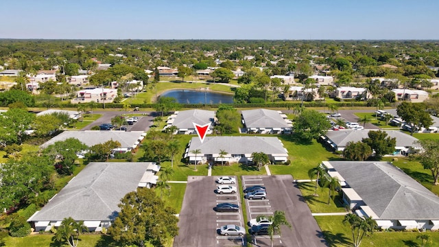 birds eye view of property with a residential view and a water view