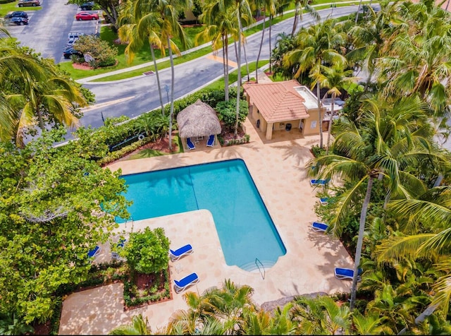 outdoor pool with a gazebo and a patio