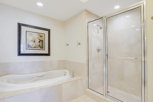 2650 Lake Shore Dr Unit 703, Riviera Beach, FL 33404 - bathroom featuring recessed lighting, a bath, and a stall shower