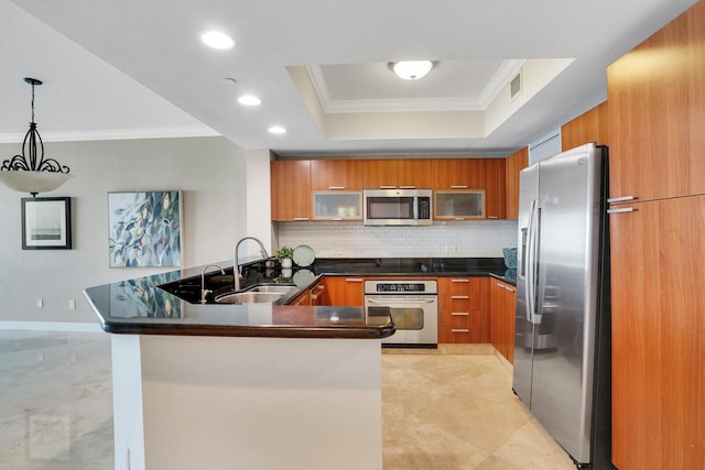 2650 Lake Shore Dr Unit 703, Riviera Beach, FL 33404 - kitchen featuring brown cabinetry, a raised ceiling, appliances with stainless steel finishes, and a sink