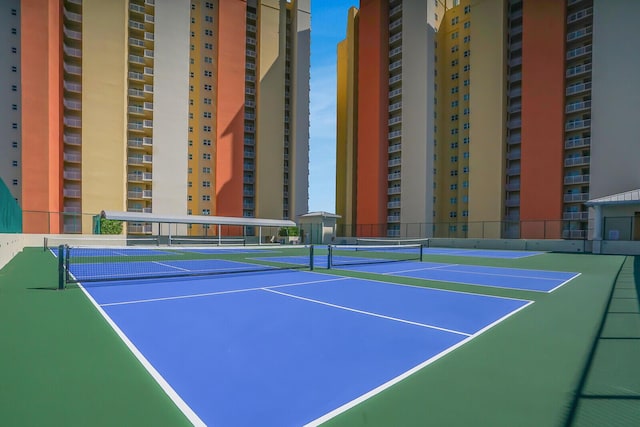 2650 Lake Shore Dr Unit 703, Riviera Beach, FL 33404 - view of tennis court featuring fence