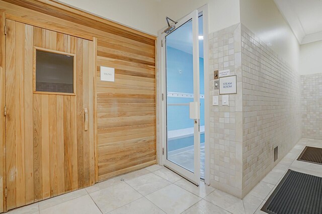 2650 Lake Shore Dr Unit 703, Riviera Beach, FL 33404 - bathroom featuring crown molding and tile patterned flooring