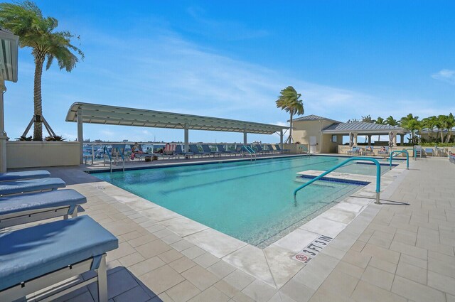 2650 Lake Shore Dr Unit 703, Riviera Beach, FL 33404 - pool with a patio