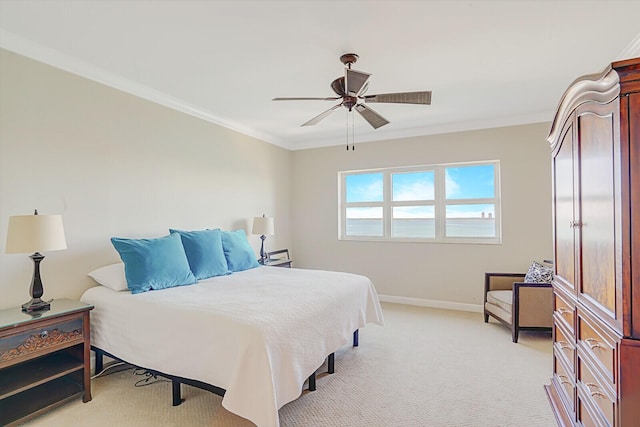 2650 Lake Shore Dr Unit 703, Riviera Beach, FL 33404 - bedroom featuring crown molding, baseboards, a ceiling fan, and light carpet