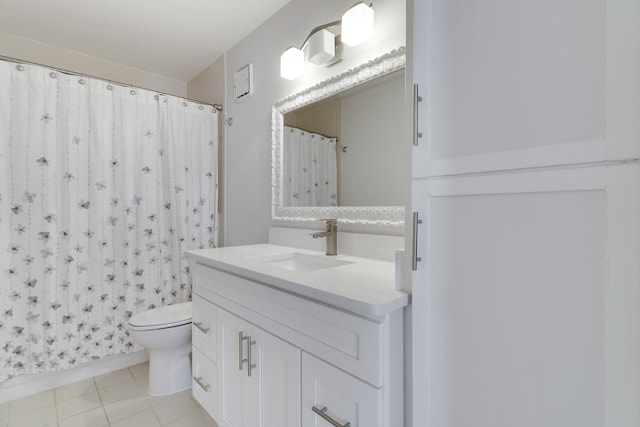 bathroom with curtained shower, toilet, vanity, and tile patterned flooring