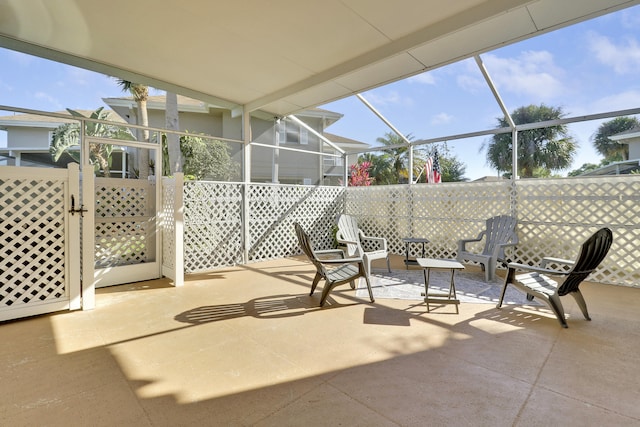 view of patio with a lanai