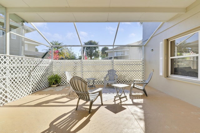 view of patio / terrace featuring a lanai