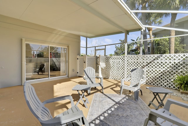 view of patio / terrace with a lanai