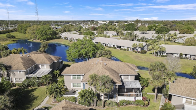 birds eye view of property featuring a residential view and a water view