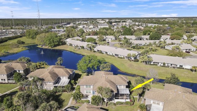 bird's eye view featuring a residential view and a water view