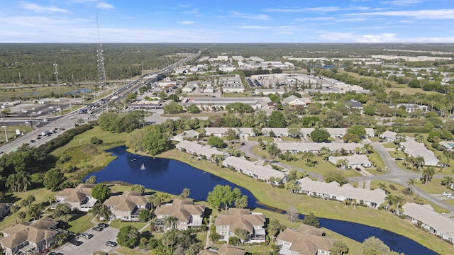 bird's eye view featuring a water view and a residential view