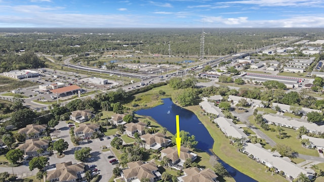 bird's eye view featuring a residential view and a water view