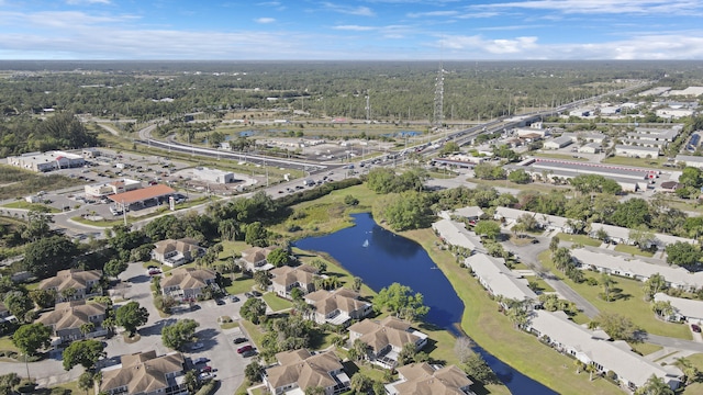 drone / aerial view featuring a residential view and a water view