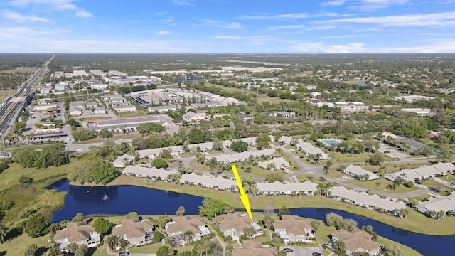 birds eye view of property with a residential view and a water view