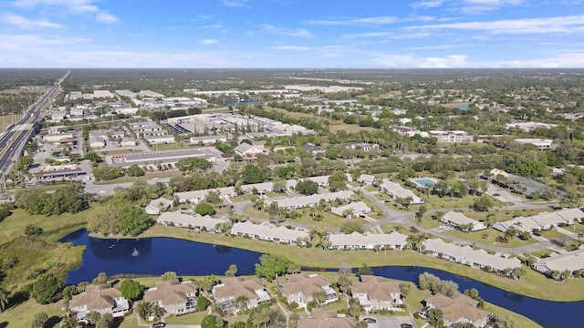 birds eye view of property featuring a residential view and a water view