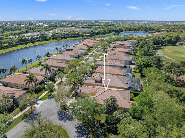 drone / aerial view featuring a residential view and a water view