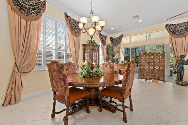 dining space with visible vents, crown molding, light tile patterned floors, baseboards, and a chandelier