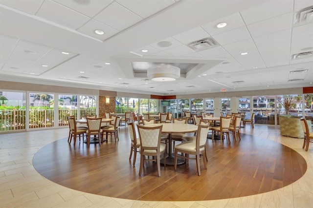 dining area with visible vents, recessed lighting, and wood finished floors