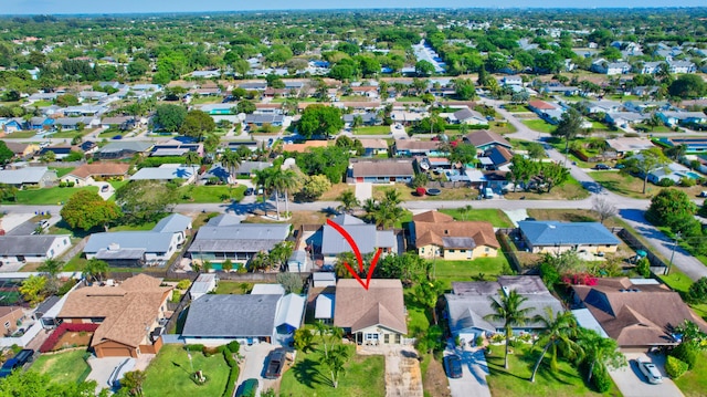 birds eye view of property with a residential view