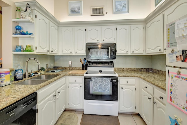 kitchen with visible vents, a sink, light tile patterned flooring, black appliances, and open shelves