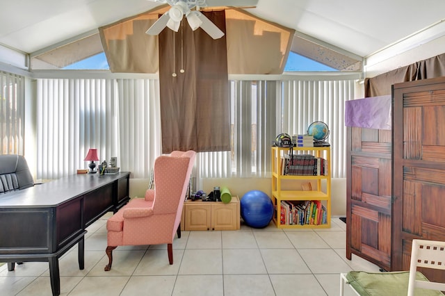 office area with lofted ceiling, plenty of natural light, a ceiling fan, and light tile patterned floors