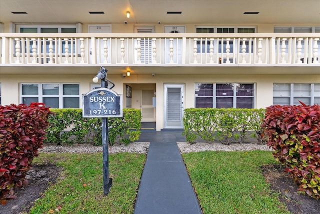 property entrance with stucco siding