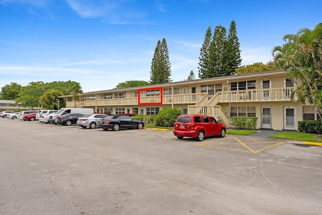 view of property with uncovered parking