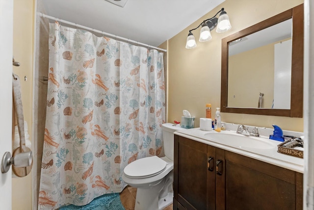 full bathroom with a shower with shower curtain, toilet, and vanity