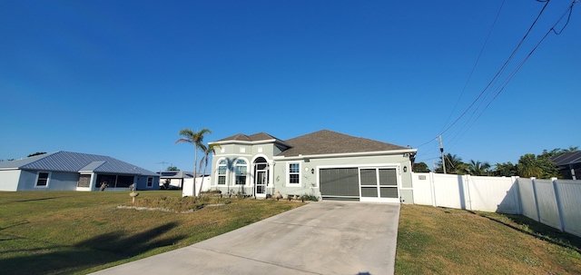 view of front of property with fence, an attached garage, stucco siding, a front lawn, and concrete driveway