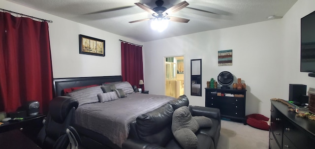 bedroom with a textured ceiling, ensuite bathroom, ceiling fan, and carpet floors