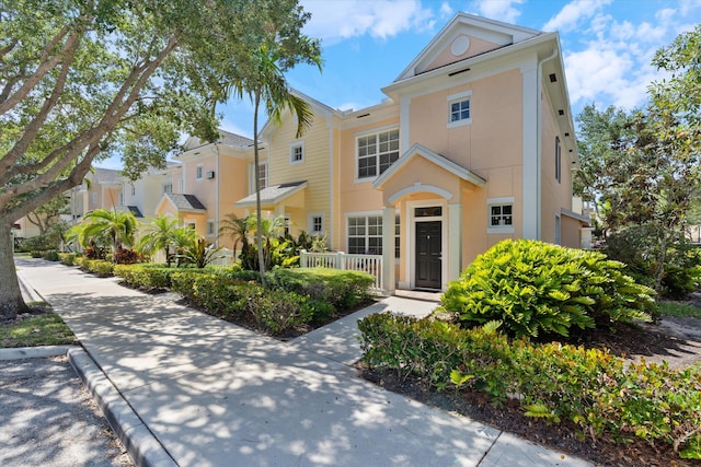 826 Dakota Dr Unit 105, Jupiter, FL 33458 - view of property featuring stucco siding