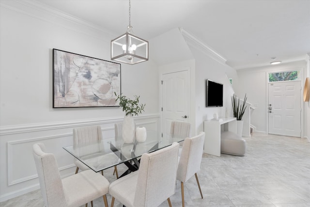 826 Dakota Dr Unit 105, Jupiter, FL 33458 - dining space with a chandelier, crown molding, and wainscoting