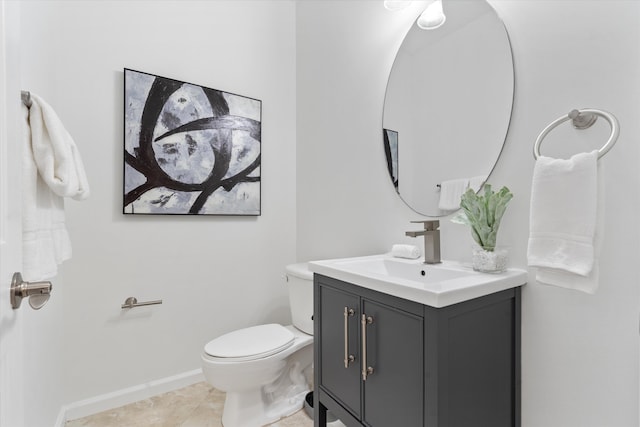 826 Dakota Dr Unit 105, Jupiter, FL 33458 - half bath with toilet, vanity, tile patterned flooring, and baseboards