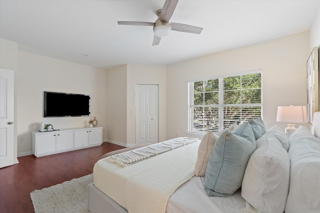 826 Dakota Dr Unit 105, Jupiter, FL 33458 - bedroom featuring dark wood-type flooring, baseboards, and ceiling fan