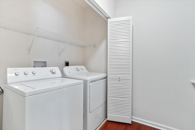 826 Dakota Dr Unit 105, Jupiter, FL 33458 - laundry area with washer and clothes dryer, dark wood-type flooring, and baseboards