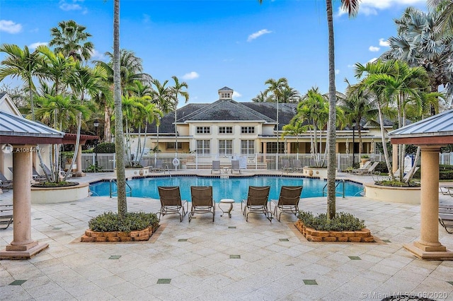 826 Dakota Dr Unit 105, Jupiter, FL 33458 - community pool featuring a gazebo, fence, and a patio