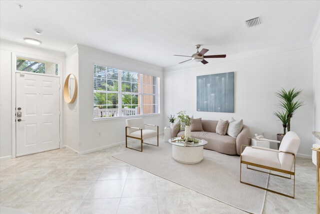 826 Dakota Dr Unit 105, Jupiter, FL 33458 - living area with ornamental molding, plenty of natural light, a ceiling fan, and baseboards