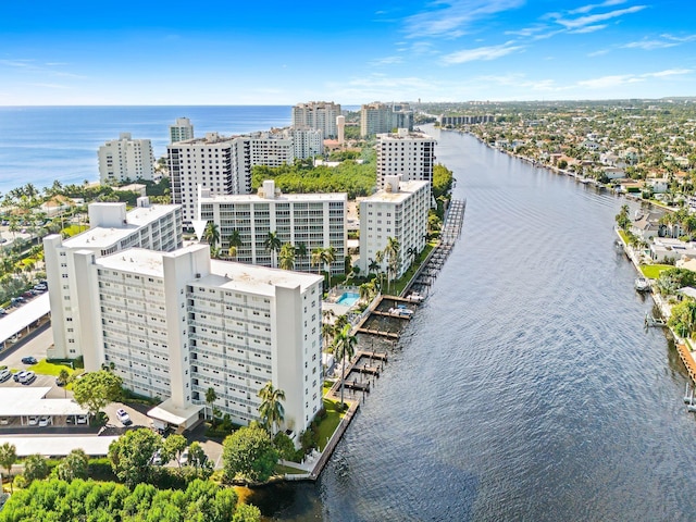 birds eye view of property featuring a view of city and a water view