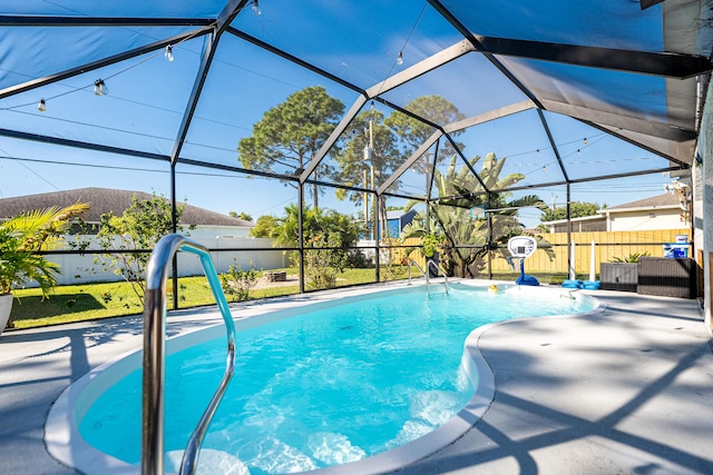 view of swimming pool featuring a fenced in pool, fence, a lanai, a patio area, and a mountain view