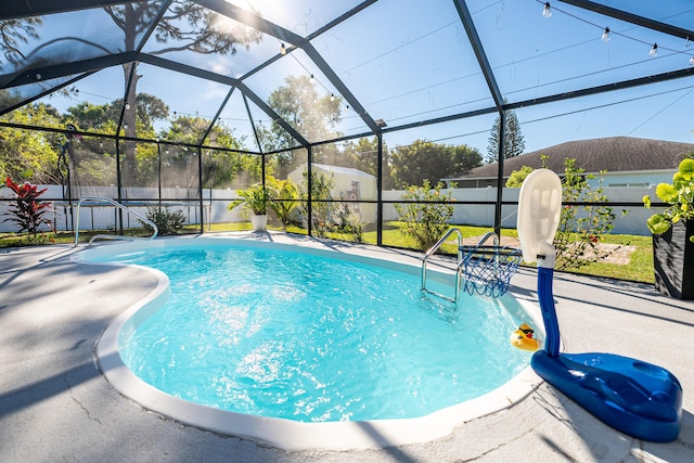 view of swimming pool with a patio area, a fenced in pool, a lanai, and a fenced backyard