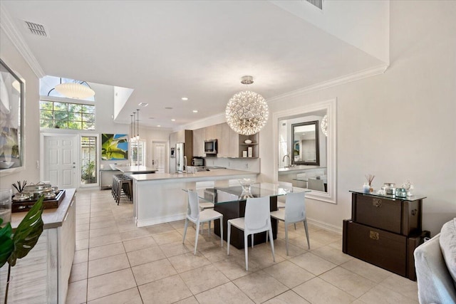 2623 Muirfield Ct, Wellington, FL 33414 - dining area with light tile patterned floors, visible vents, an inviting chandelier, and crown molding