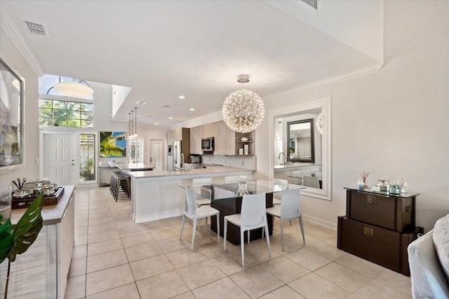 dining area with light tile patterned floors, visible vents, an inviting chandelier, and crown molding