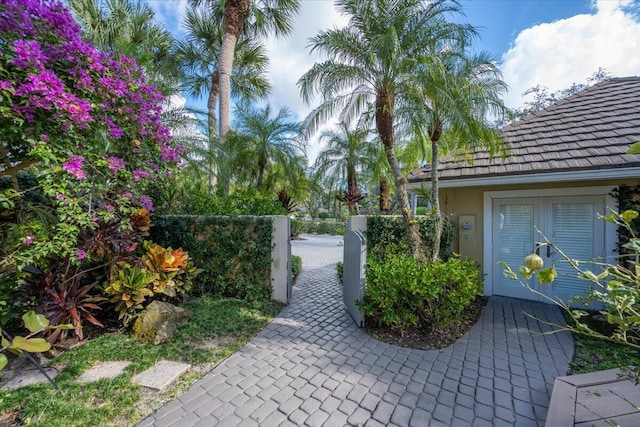 exterior space featuring a fenced front yard and a gate