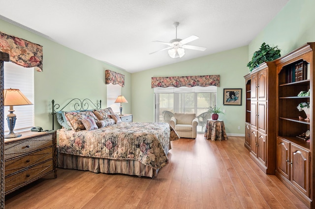 bedroom featuring light wood-style flooring, a ceiling fan, and vaulted ceiling