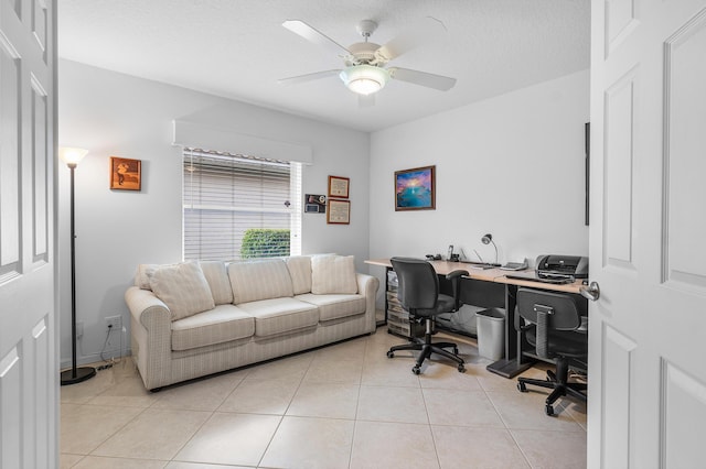 office area featuring light tile patterned floors, a ceiling fan, and a textured ceiling