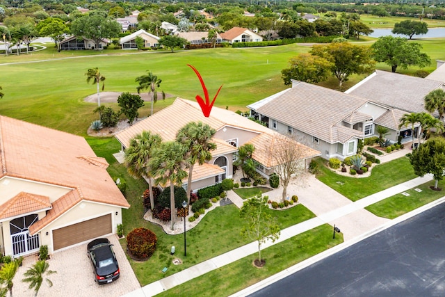 bird's eye view with a residential view, golf course view, and a water view