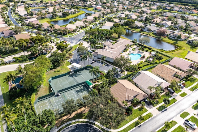 drone / aerial view with a residential view and a water view